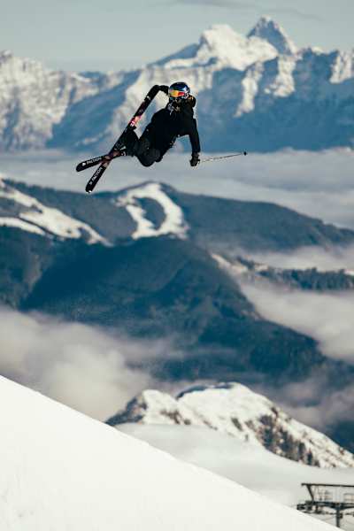Eileen Gu flies high above the half pipe at Kitzsteinhorn, Austria during a skiing session in November 2023.