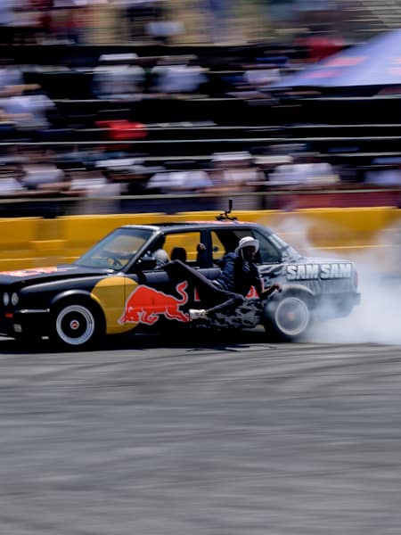 Samkeliso Thubane drifts spectacularly during Mfest 2024 at Kyalami in Johannesburg, South Africa, sending smoke soaring as the crowds cheer the thrilling motorsport display.