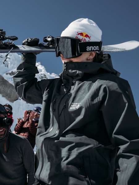 Manon Loschi carrying her skis - the French athlete celebrates her win at the NST Ski premiere.