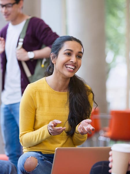 A group of friends at university having a conversation