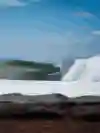 Lee Wilson rides the tube while surfing on Bali's east coast
