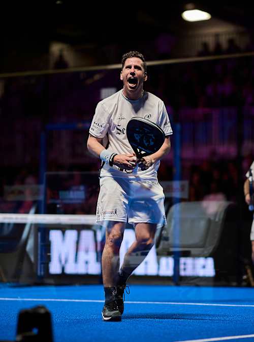 Francisco Navarro in action during the quarter-finals of the 2025 Motorola Razr Miami Premier Padel P1 in Miami, USA, showcasing elite padel skill on a vibrant blue court