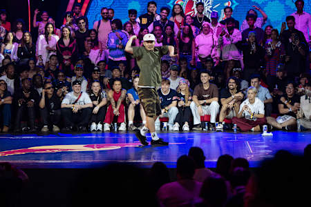 In 2024, MT Pop graces Red Bull's Dance Your Style World Final stage in Mumbai with colourful moves.