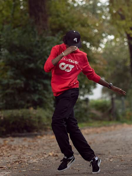 House dancer Mamson performs in a street for a photo shoot.