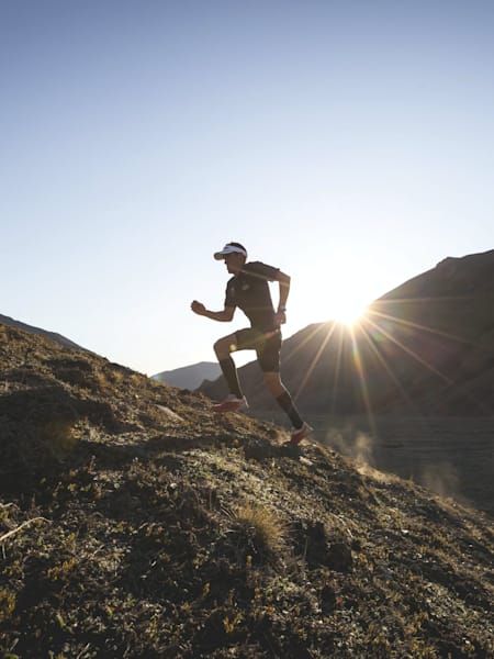 Braden Currie runs up a mountain as part of a training session.