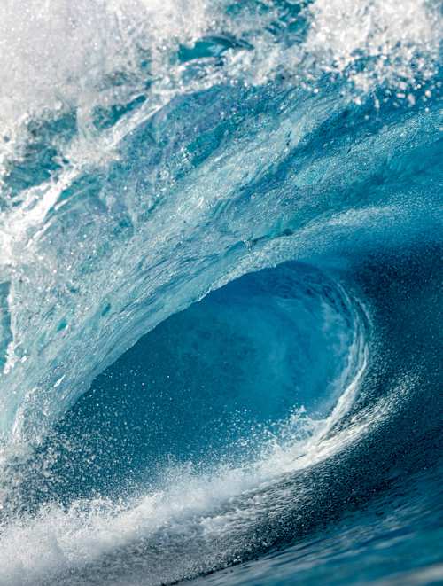 A thundering empty wave barrels at the iconic Banzai Pipeline during the Red Bull Volcom Pipe Pro on Oahu, Hawaii, USA in January 2020, capturing pure surf energy and adventure