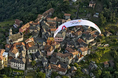 Participant flies during the Red Bull X-Alps preparations in Cannóbio, Italy, on June 21, 2017.