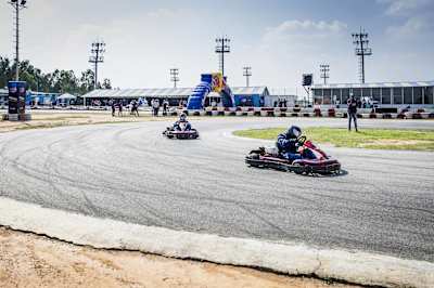 Karters compete on a track at the Meco Kartopia circuit in Bangalore.