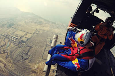 Jokke Sommer sits on the edge of the plane and gets ready for his jump.