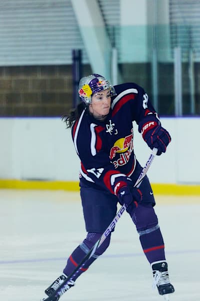 Hilary Knight lines up a shot during ice hockey practice.