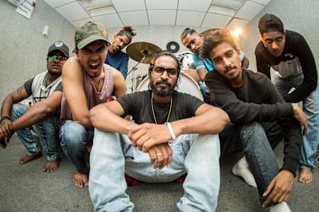 Emiway Bantai poses with his crew in a recording studio