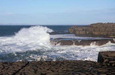 The cliffs of Moher provide a breath-taking backdrop as you ride the waves