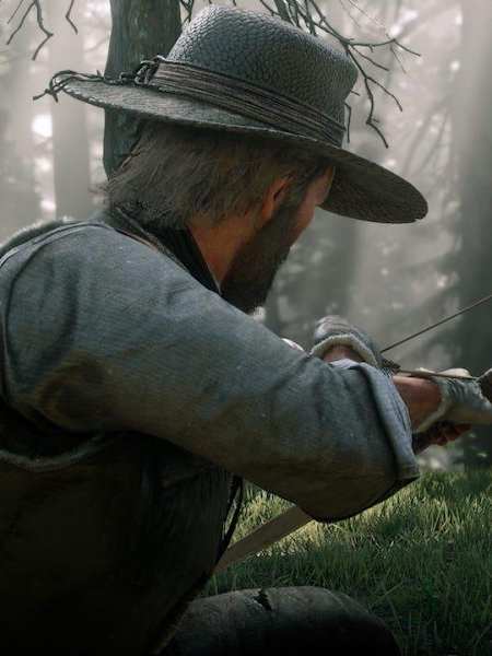 A promotional screenshot of Arthur Morgan hunting deer in Red Dead Redemption 2