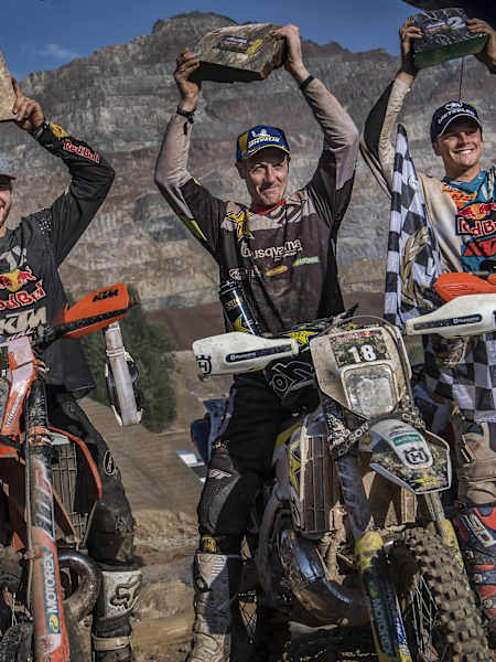 Manuel Lettenbichler of Germany, Graham Jarvis of the UK and Jonny Walker of the UK celebrate at the Erzbergrodeo Red Bull Hare Scramble at the Erzberg in Eisenerz, Austria on June 3, 2018
