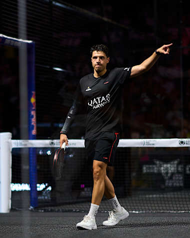 Agustin Tapia is captured in action on July 6, 2025 at the Bordeaux Premier Padel P2 finals in France, with Red Bull branding powering the energetic atmosphere
