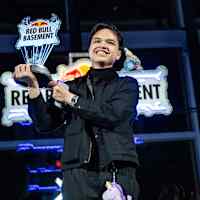 Soi Gamayon of AGRICONNECT proudly raises the champion's trophy during the Red Bull Basement World Final in Tokyo, Japan, December 2024