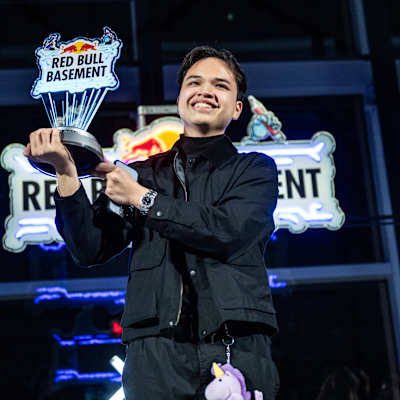 Soi Gamayon of AGRICONNECT proudly raises the champion's trophy during the Red Bull Basement World Final in Tokyo, Japan, December 2024
