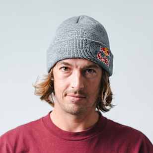 In 2023, Ryan Decenzo holds his skateboard during a Red Bull Performance Camp photoshoot in Vista, California