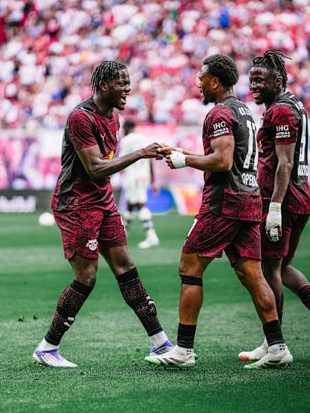 RB Leipzig players celebrate on the pitch during their friendly match against Atalanta Bergamo in Leipzig.
