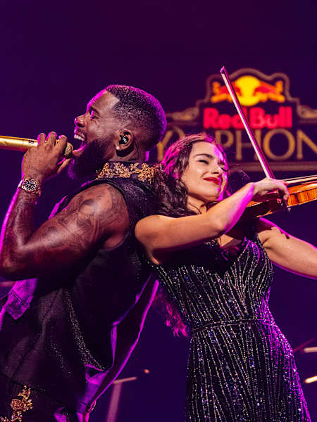 Tayc sings alongside violinist Esther Abrami during Red Bull Symphonic at Théâtre des Champs-Elysées in Paris, France, November 2025
