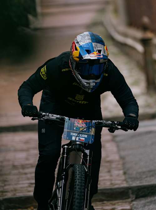 Tomáš Slavík rides with intensity at the Red Bull Cerro Abajo event in Genova, Italy, near Teatro Nazionale Genova on August 24th, 2025, showcasing thrilling downhill mountain biking action
