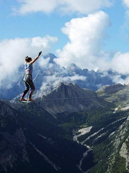 A slackliner in action high in the mountains.