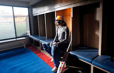 Indian women's cricket team opening batter Smriti Mandhana in a cricket changing room.