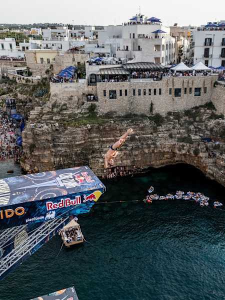 Constantin Popovici of Romania dives from the 27.5 metre platform during the final competition day of the 2024 Red Bull Cliff Diving World Series in Polignano a Mare, Italy on June 30, 2024.