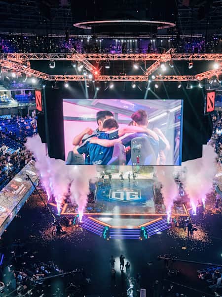An image of OG on stage at TI9 in Shanghai in 2019