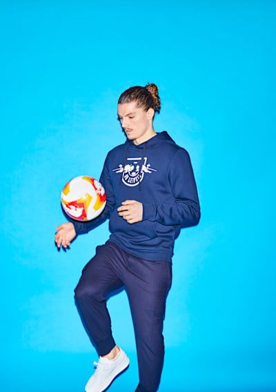 Marcel Sabizter kicks a football during a photoshoot for The Red Bulletin.