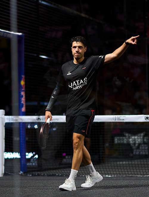 Agustin Tapia is captured in action on July 6, 2025 at the Bordeaux Premier Padel P2 finals in France, with Red Bull branding powering the energetic atmosphere