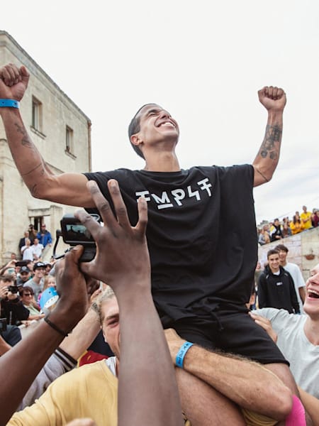 Didi Alaoui from Marocco celebrates his win after the finals at the Red Bull Art of Motion freerunning competition in Matera, Italy on October 5, 2019.