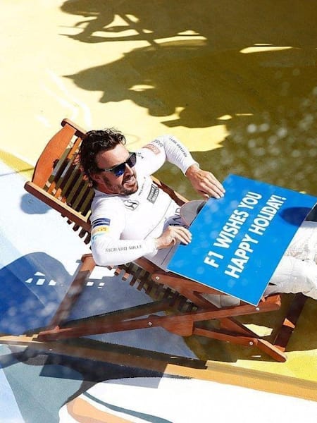 Fernando Alonso poses for a portrait in a deckchair at the 2017 Hungarian Grand Prix.