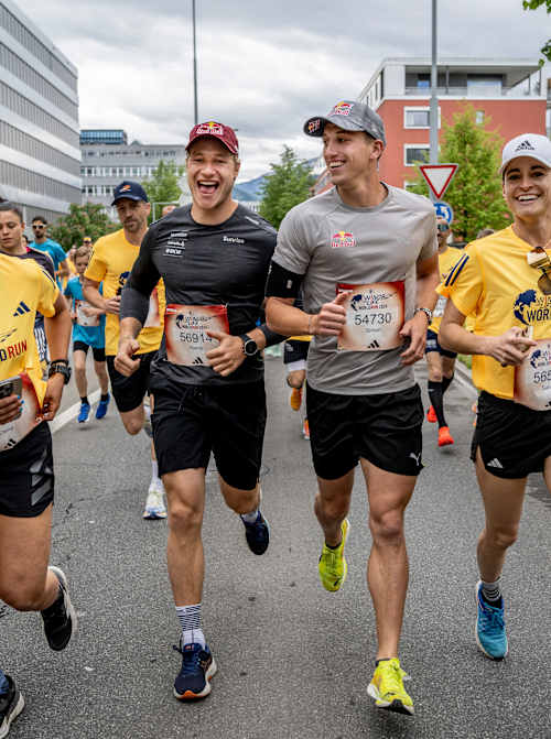 Marco Odermatt (C-L) and Simon Ehammer (C-R) of Switzerland perform during the Wings for Life World Run Flagship Run in Zug, Switzerland on May 05, 2024.