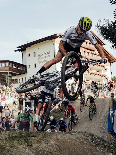 Nino Schurter whips his bike during a lap of the XCC race at the UCI XCO World Cup at Lenzerheide, Switzerland, on August9, 2019.