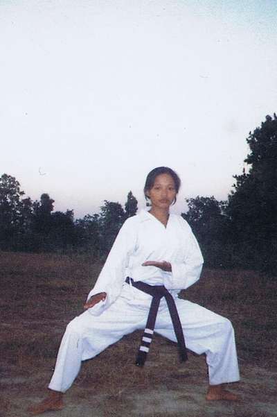 An image of Mira Rai as a child in karate uniform.