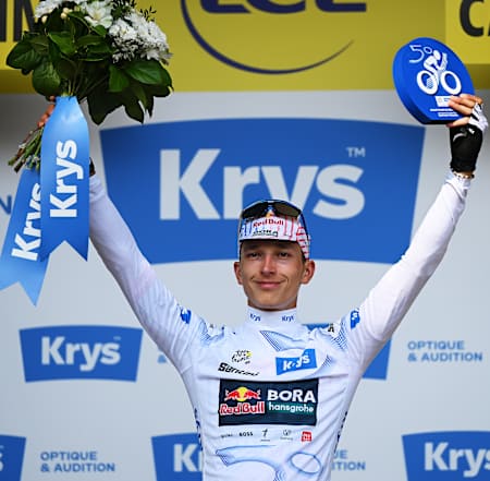 Florian Lipowitz of Team Red Bull - BORA - hansgrohe celebrates on the podium as White best Young Rider Jersey winner during the 112th Tour de France 2025, Stage 15.
