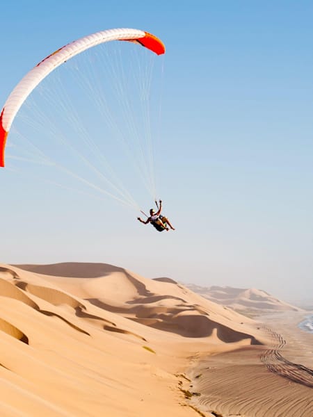 Horacio Llorens paraglides in Sandwich Bay, Namibia, on March 23, 2012.