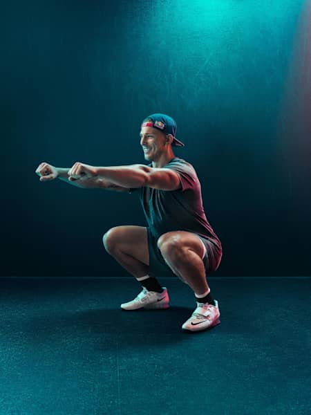 A Red Bull athlete demonstrates squat technique.