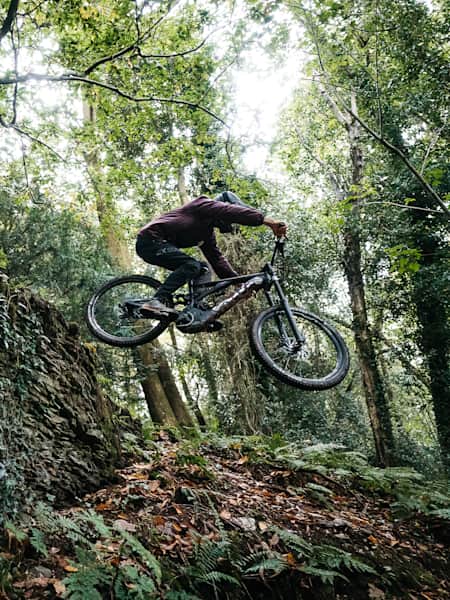 A mountain biker rider rides on the Specialized Turbo Kenevo Expert eMTB.