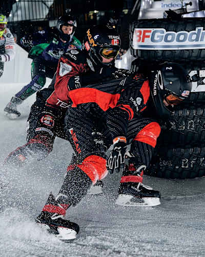 Cameron Naasz of the USA, Maxwell Dunne of the USA, Mirko Lahti of Finland and Kyle Croxall of Canada compete during the finals  at the Red Bull Crashed Ice in Yokohama, Japan on December 8, 2018.