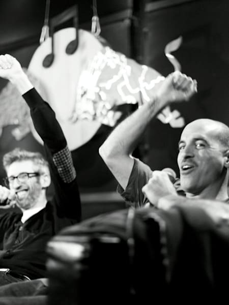 Stretch and Bobbito sit on a couch in a Red Bull Academy studio.
