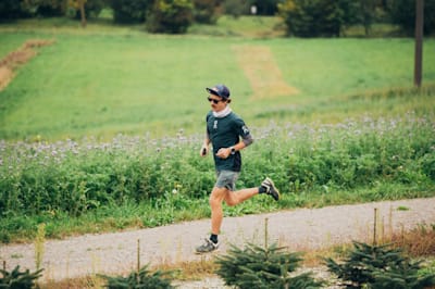 Florian Neuschwander running on a trail in Laufen, Switzerland