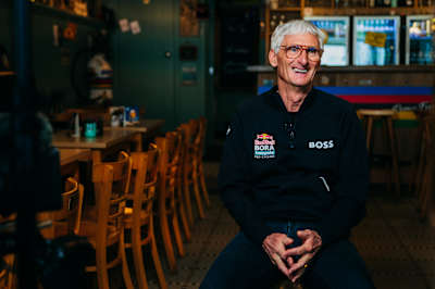 Allan Peiper represents Red Bull - BORA - hansgrohe during a Eurosport 2026 interview in Geraardsbergen, Belgium, emphasising the team's presence in professional cycling