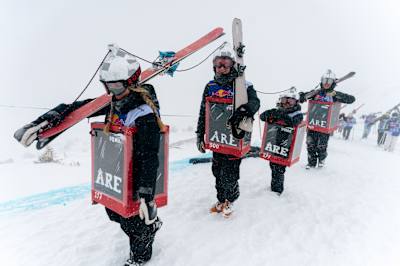 Energetic skiers dressed for action at Red Bull Homerun in Åre, Sweden, on April 5, 2026, charging uphill in snowy conditions for this iconic Red Bull winter race