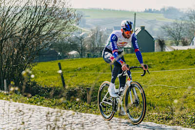 Jordi Meeus of Red Bull - BORA - hansgrohe rides over cobbles during the 81st Omloop Nieuwsblad Recon in Gavere, Belgium, on 26 February 2026