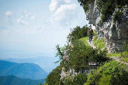 MTB riders Eugenio Carugati and Alesino Clignon riding in Alpe Cimbra, Italy on June 26, 2018.