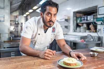 Chef Thomas Zacharias poses with his Egg's Kejriwal dish