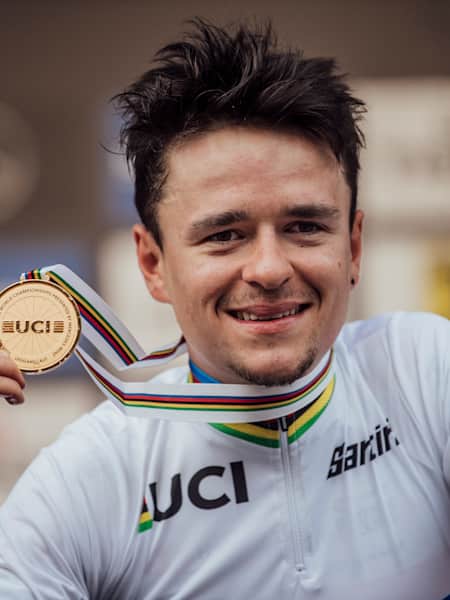 Thomas Pidcock poses with the gold medal at UCI XC World Championships in Leogang, Austria on October 9th, 2020.