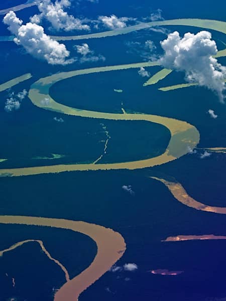 Aerial view of the Amazon river wiggeling trough the rain forest.